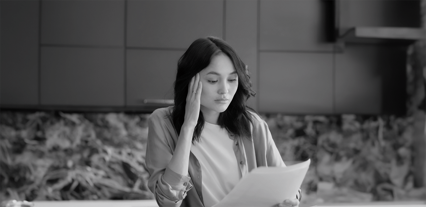 Woman reading something on a piece of paper