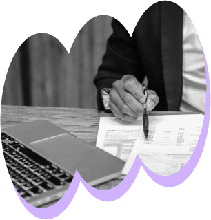 Black and white picture of executive going through paperwork