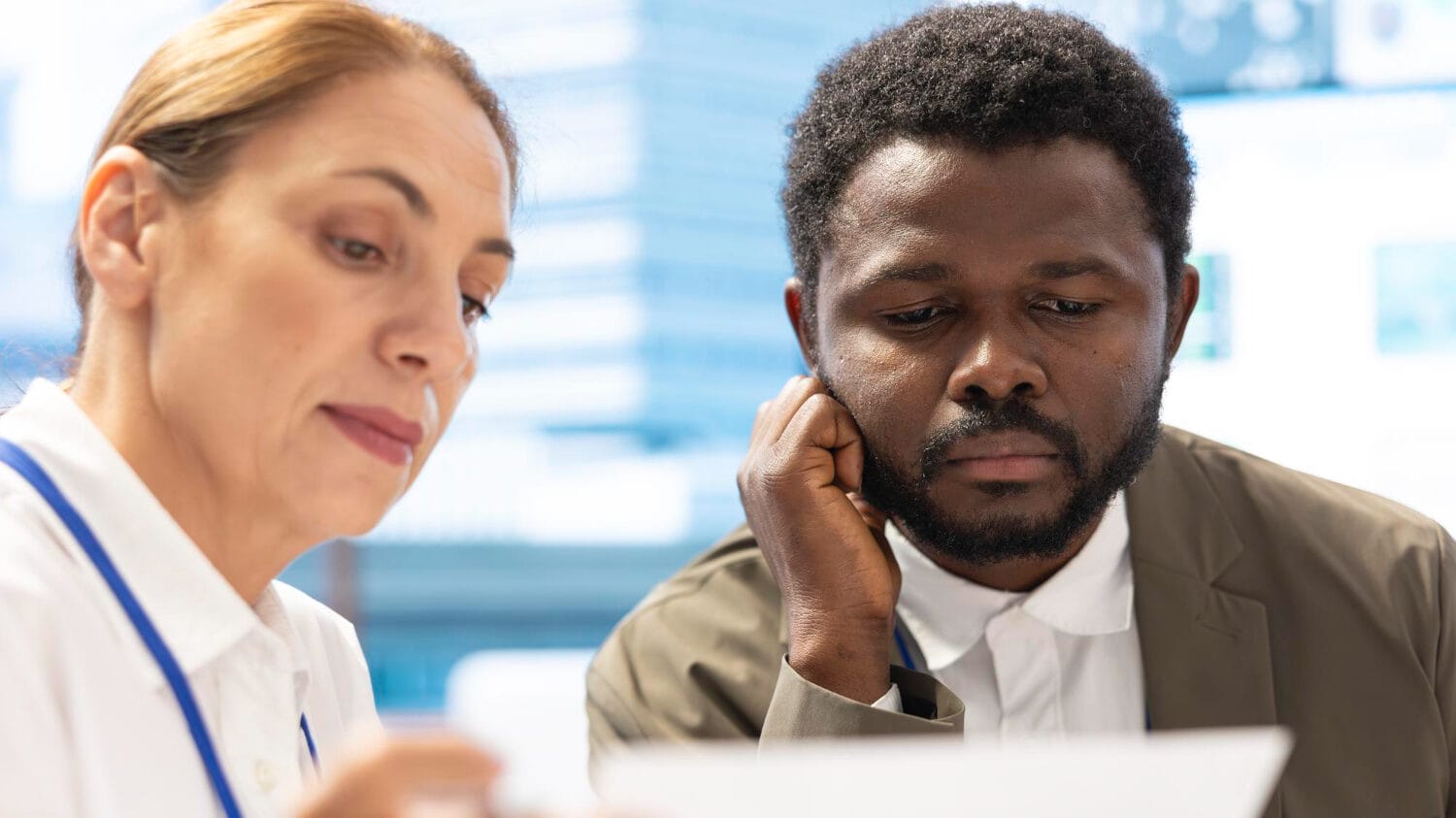 Professionals reviewing documents to understand errors and omissions insurance policy coverage