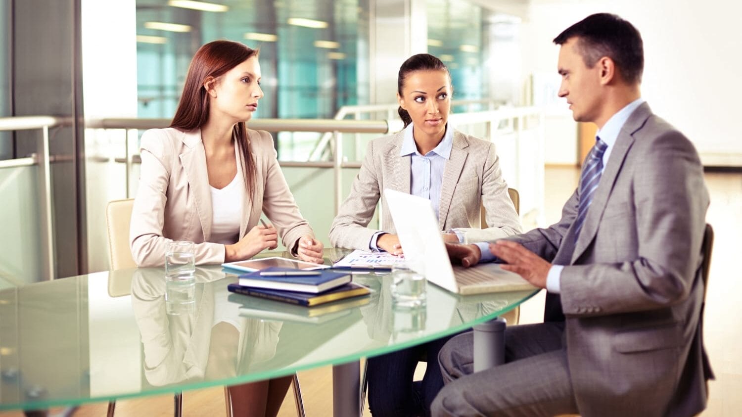 Business meeting discussing coverage options for professional indemnity insurance