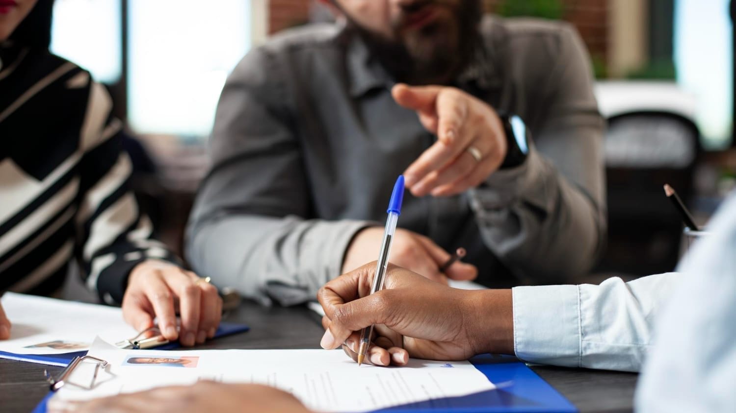 Team reviewing professional indemnity insurance for technology companies