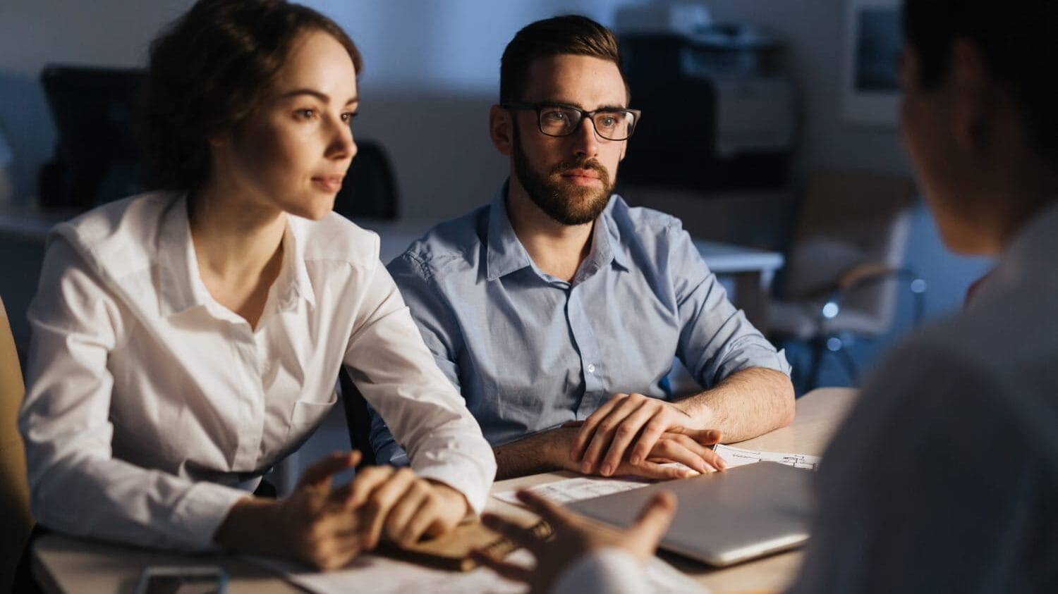 Consultants discussing technology consulting insurance strategy