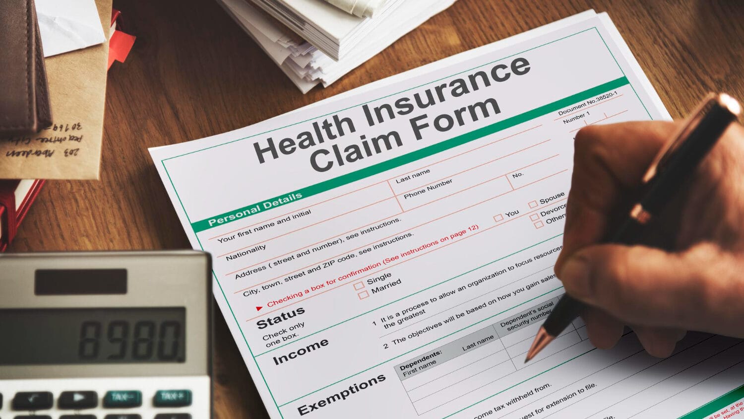 Types of professional liability insurance claim form and paperwork on desk