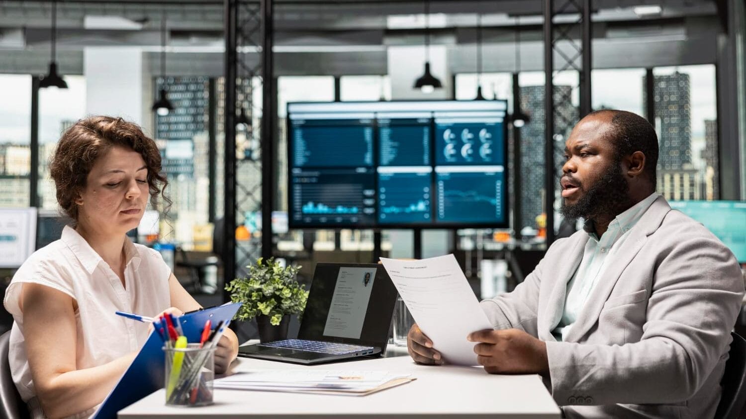 Business team reviewing technology consulting insurance plans