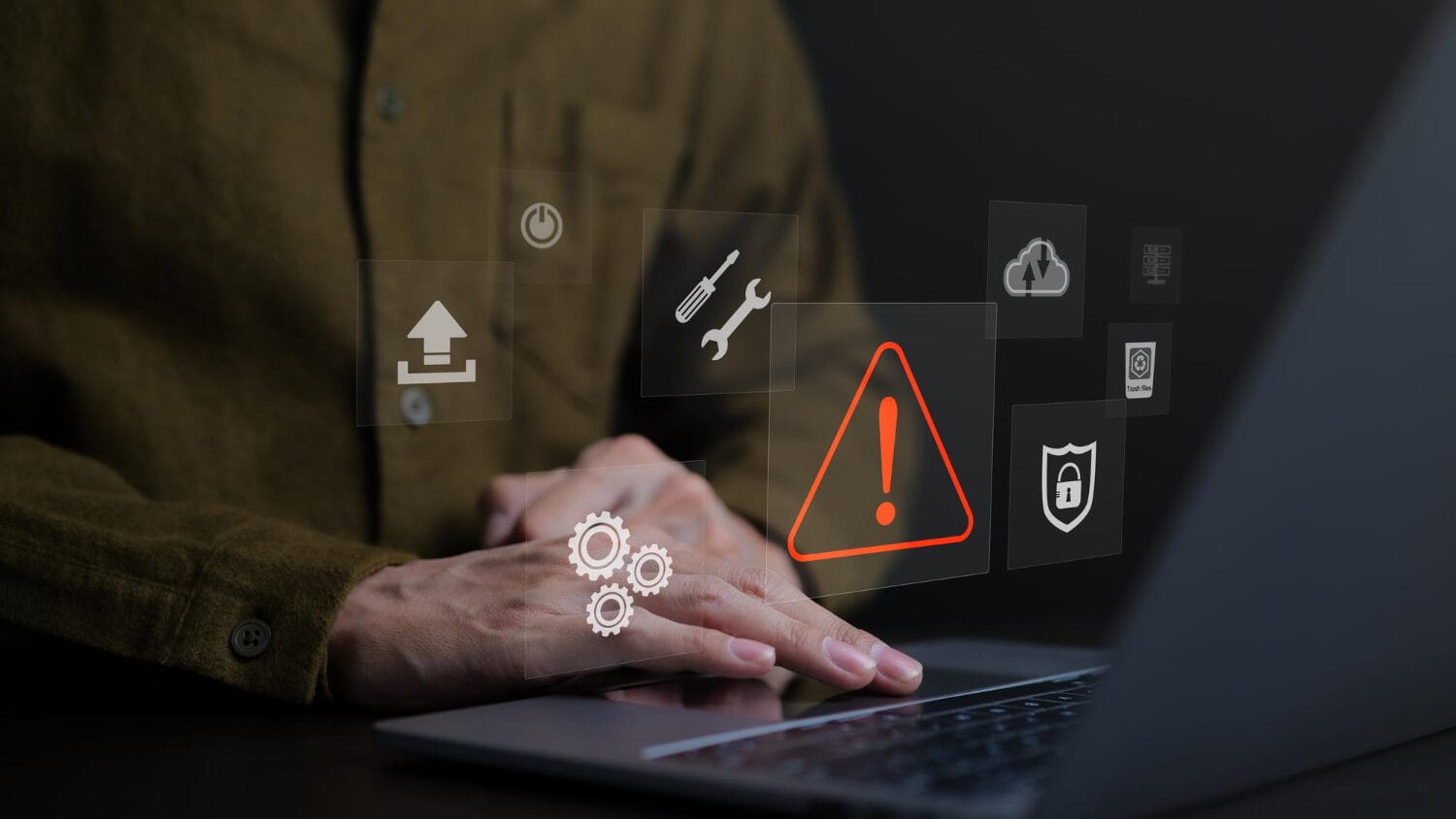 Laptop warning icons illustrating technical errors and omissions insurance