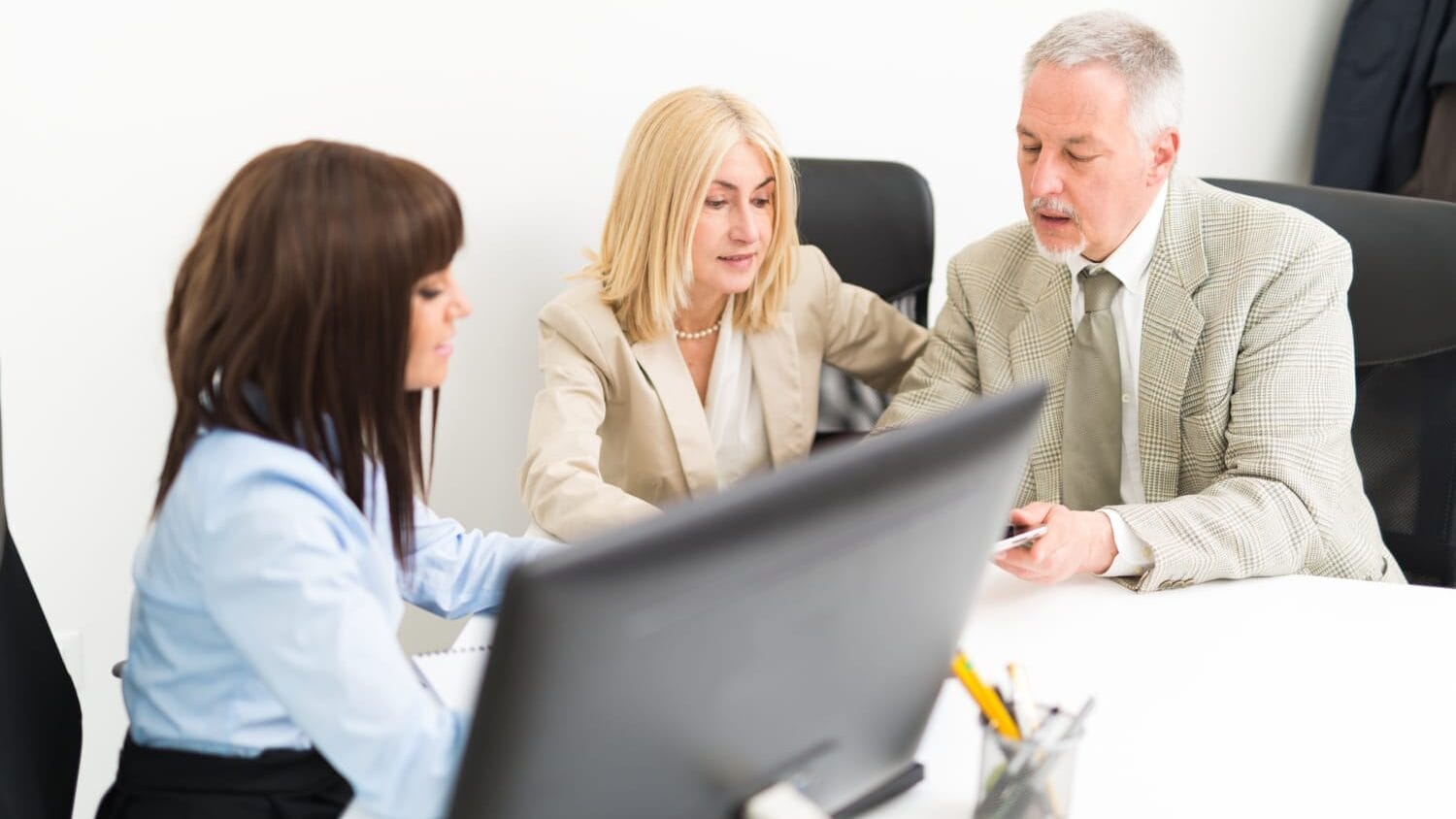 Executives reviewing directors and officers insurance