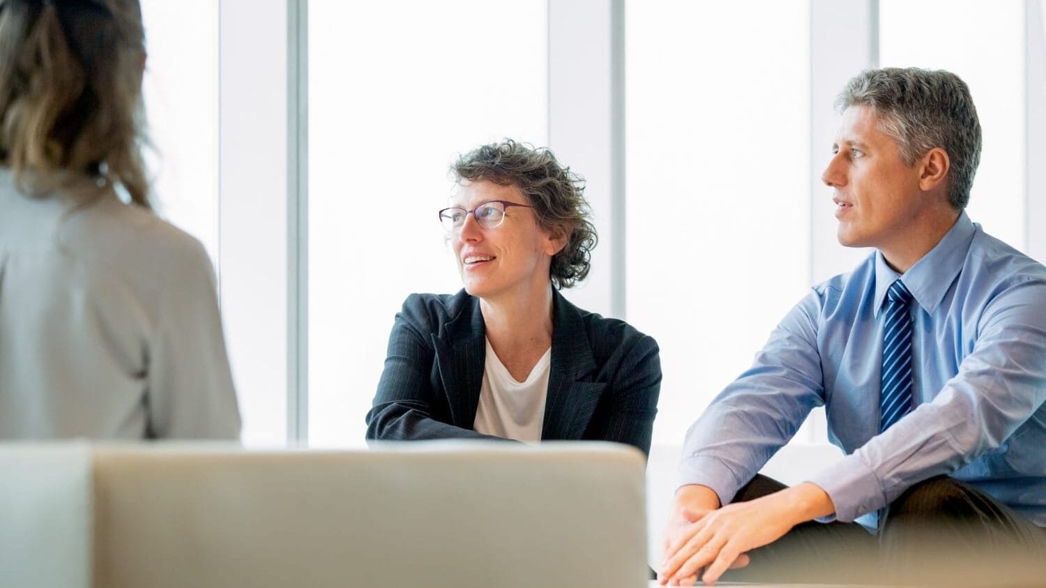 Executives discussing directors and officers liability insurance