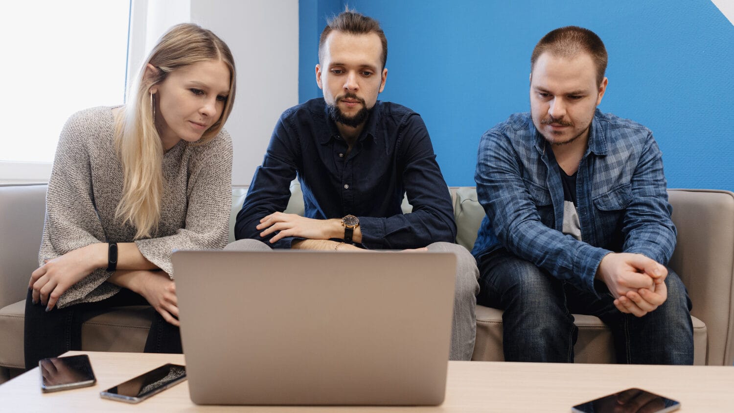 Team discussing technology liability insurance options