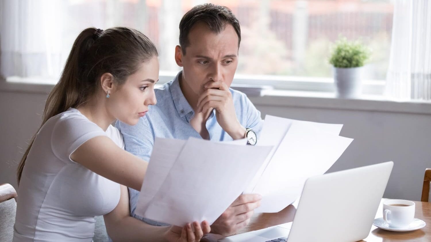 Couple reviewing Professional Liability (E&O) Insurance documents