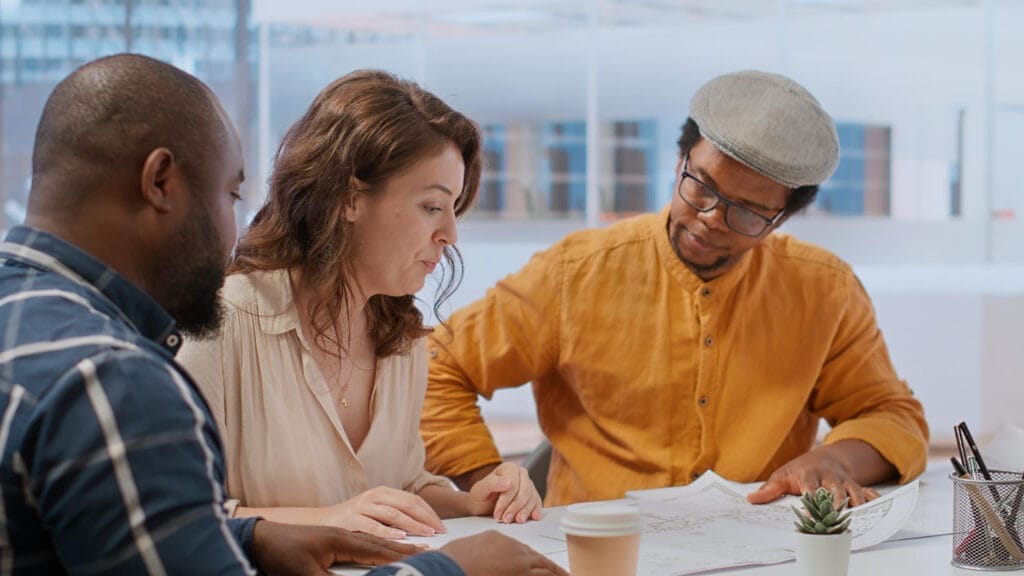 Consultants discussing contract documents